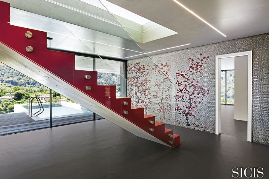 Interior, red staircase in modern villa